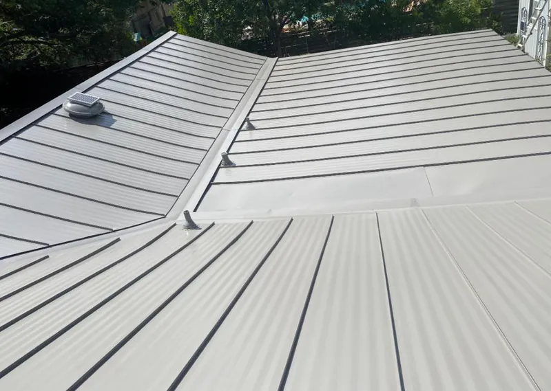Solar attic fan installed on a metal roof for Roof Ventilation in Knik-Fairview